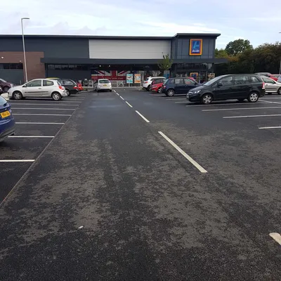 Supermarket car park with fresh surfacing and parking bay markings